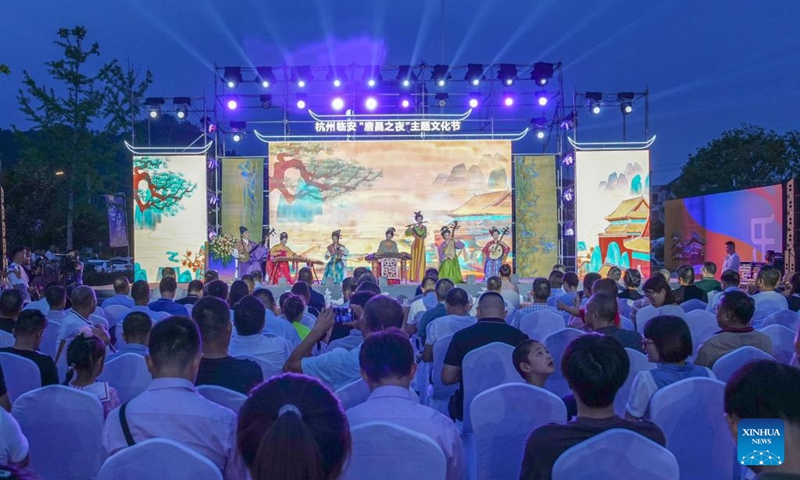 This photo taken on Aug. 18, 2023 shows the opening ceremony of a cultural festival in Changhua Town of Hangzhou City, east China's Zhejiang Province. The cultural festival, which kicked off Friday in Changhua Town, aimed to boost the nighttime economy by presenting the culture of Tang (618-907) and Song (960-1279) Dynasties and promoting local snacks and scenic spots. (Xinhua/Xu Yu)