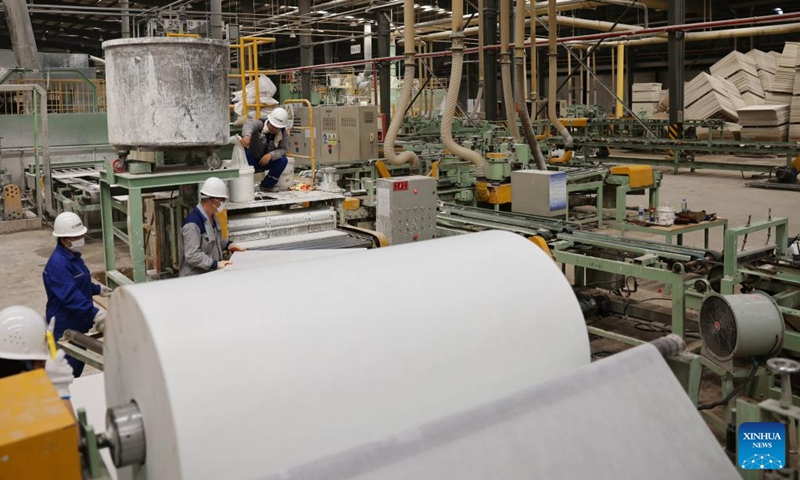 Workers work at a mineral wool workshop of a building materials company in Zhuozhou City, north China's Hebei Province, Aug. 19, 2023. At present, the post-disaster recovery and reconstruction work is intensively carried out in Zhuozhou City. The local government has been speeding up the repair of infrastructure and assisting enterprises to resume production. (Xinhua/Luo Xuefeng)