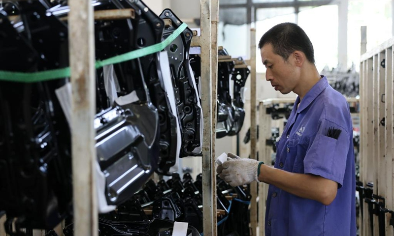 A worker works at a workshop of an automotive system company in Zhuozhou City, north China's Hebei Province, Aug. 19, 2023. At present, the post-disaster recovery and reconstruction work is intensively carried out in Zhuozhou City. The local government has been speeding up the repair of infrastructure and assisting enterprises to resume production. (Xinhua/Luo Xuefeng)