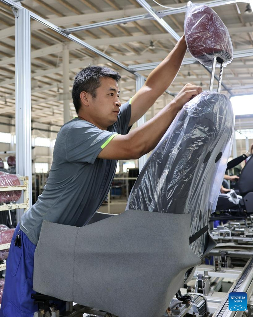 A worker works at a workshop of an automotive system company in Zhuozhou City, north China's Hebei Province, Aug. 19, 2023. At present, the post-disaster recovery and reconstruction work is intensively carried out in Zhuozhou City. The local government has been speeding up the repair of infrastructure and assisting enterprises to resume production. (Xinhua/Luo Xuefeng)