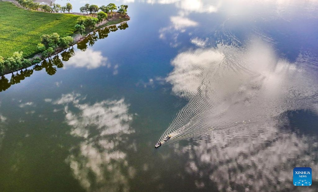 This aerial photo taken on Aug. 18, 2023 shows boats on the Luhe River in Jingbian County, Yulin City of northwest China's Shaanxi Province. Luhe River, dubbed a mother river in Jingbian County, plays an important role in agricultural production in northern Shaanxi.(Photo: Xinhua)