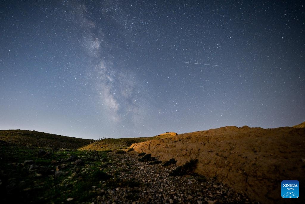 This long-time exposure photo taken on Aug. 20, 2023 shows a section of the Great Wall built in Ming dynasty (1368-1644) under the starry night sky in north China.(Photo: Xinhua)