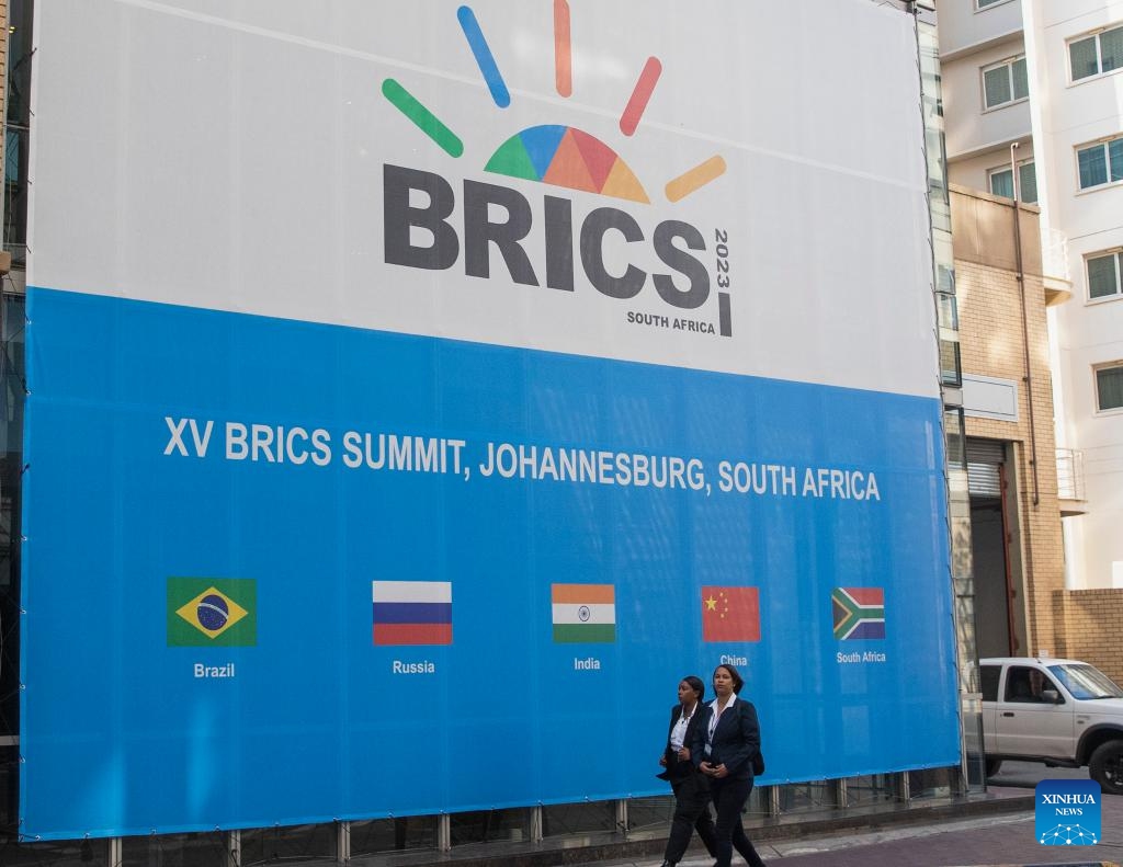 People walk near the venue of the 15th BRICS Summit in Johannesburg, South Africa, Aug. 21, 2023. The 15th BRICS Summit is scheduled to be held from Tuesday to Thursday in South Africa.(Photo: Xinhua)