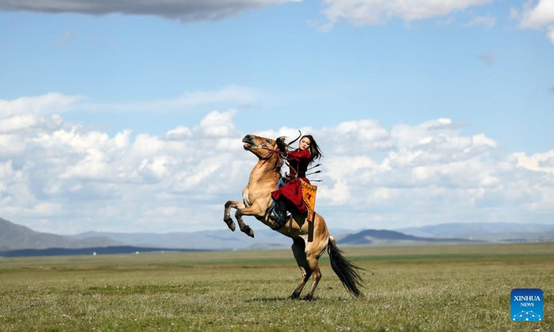 A horsewoman participates in a horsemanship performance during a nomadic culture festival in the Nalaikh District of Ulan Bator, Mongolia, Aug. 19, 2023. A cultural festival to promote Mongolia's nomadic intangible culture and the development of the tourism sector was held from Aug. 18 to 20 in the Nalaikh District of Ulan Bator.(Photo: Xinhua)