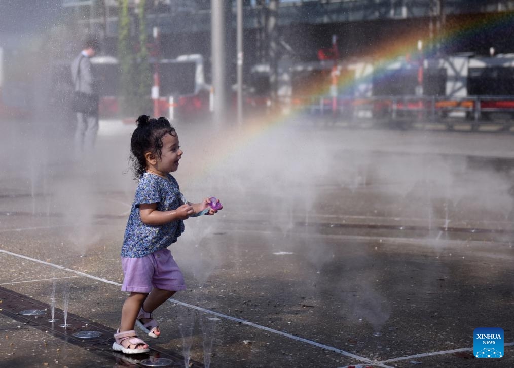 A girl cools off at a splash pad during a hot day in Vienna, Austria, on Aug. 22, 2023.(Photo: Xinhua)