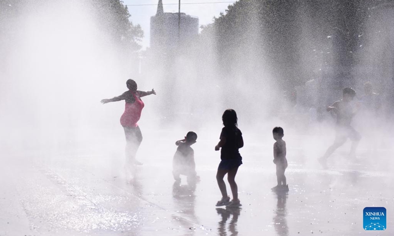 People cool off at a splash pad during a hot day in Vienna, Austria, on Aug. 22, 2023.(Photo: Xinhua)