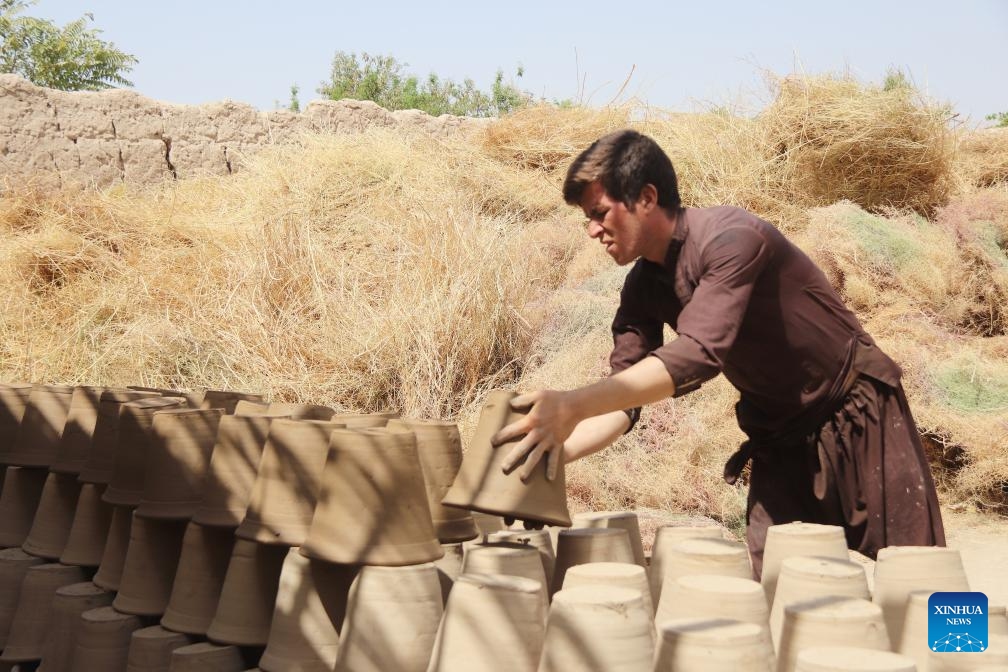 A potter works at a pottery making workshop in Balkh Province, Afghanistan, Aug. 23, 2023.(Photo: Xinhua)