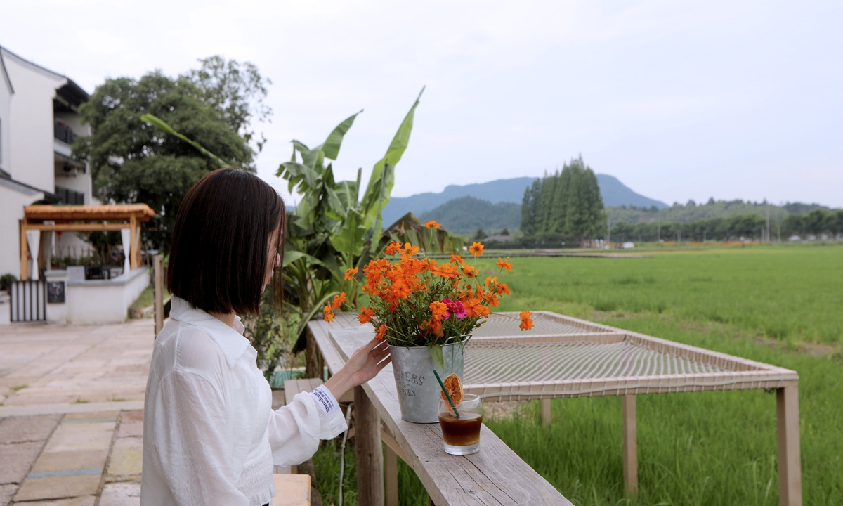 A woman drinks coffee at a café in Anji, East China's Zhejiang Province.Photo: Chen Xia/Global Times