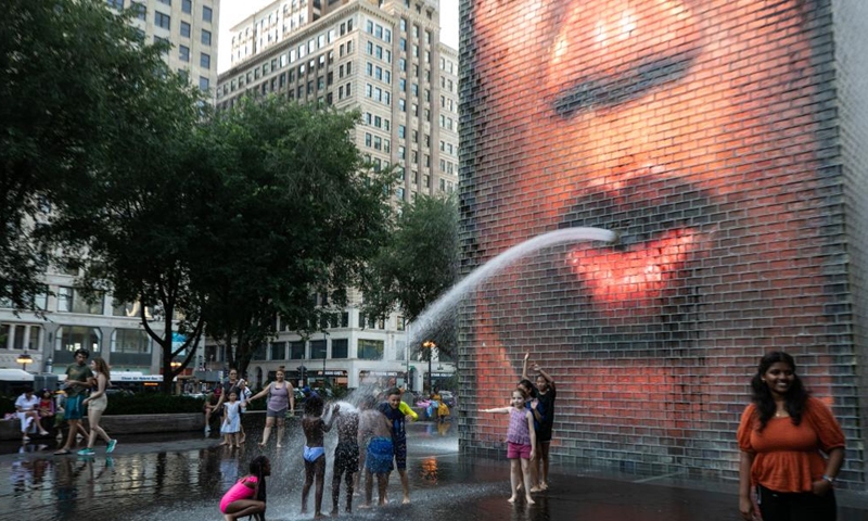 Children cool down at Crown Fountain in downtown Chicago, the United States, on Aug. 23, 2023. The temperature at O'Hare International Airport in Chicago, the third most populous city in the United States, reached 98 degrees Fahrenheit (36.67 degrees Celsius) Wednesday afternoon, breaking the city's previous daily high temperature record for Aug. 23 of 97 degrees Fahrenheit (36.11 degrees Celsius), according to the U.S. National Weather Service.(Photo: Xinhua)