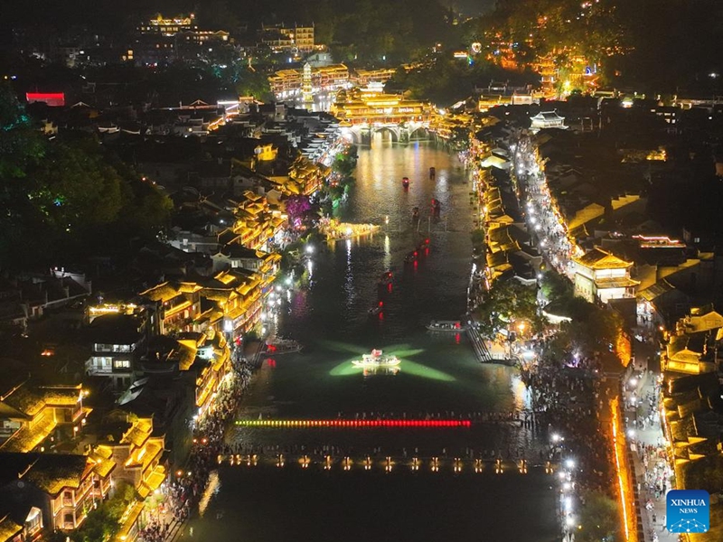 This aerial photo taken on Aug. 25, 2023 shows a night view at Fenghuang ancient town in Xiangxi Tujia and Miao Autonomous Prefecture, central China's Hunan Province. Photo: Xinhua