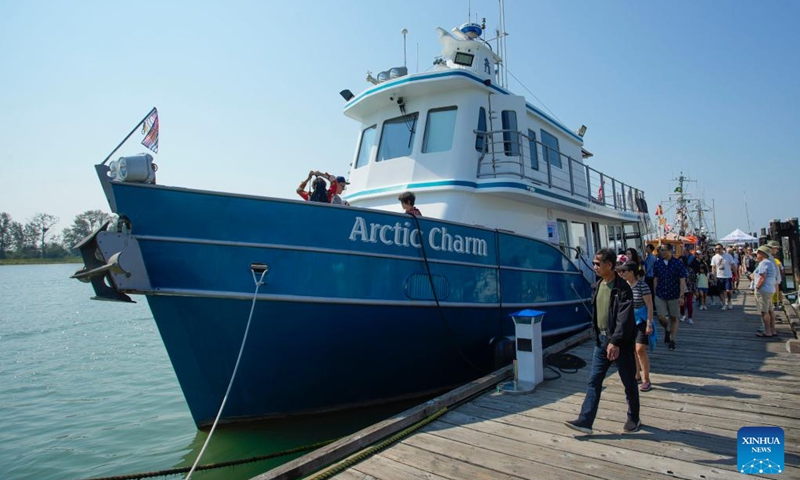 People visit a vintage ship displayed by the dock at the 20th Richmond Maritime Festival in Richmond, British Columbia, Canada, on Aug. 26, 2023. Photo: Xinhua