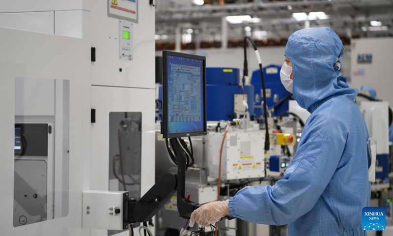 A worker works at a semiconductor wafer workshop of a company in the Western Science City in southwest China's Chongqing Municipality, Aug. 24, 2023. In recent years, Chongqing's Western Science City has vigorously implemented the intelligent manufacturing cultivation project, guiding enterprises to accelerate the intelligent transformation and digital transformation and upgrading, and helping local industries to improve quality and efficiency. (Xinhua/Wang Quanchao)