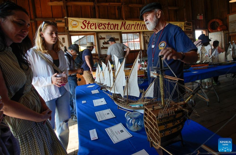 People look at ship models during the 20th Richmond Maritime Festival in Richmond, British Columbia, Canada, on Aug. 26, 2023. Photo: Xinhua