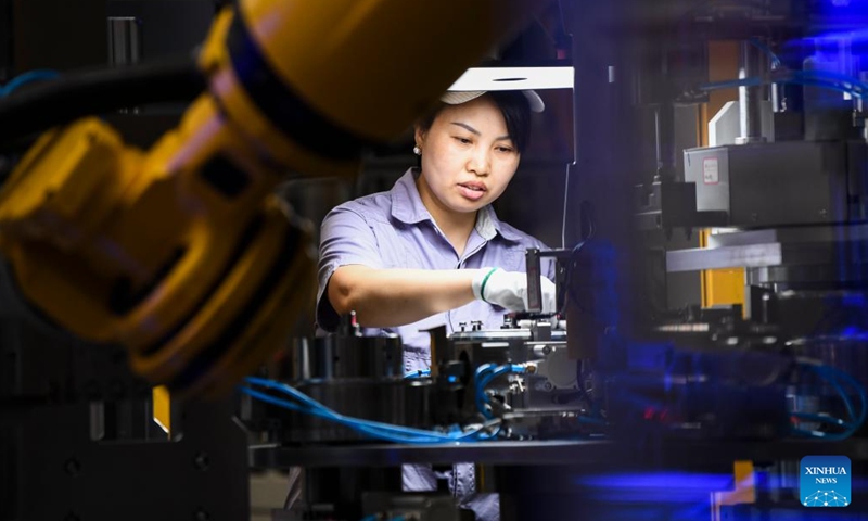 A worker works at a motor stator and rotor workshop of a company in the Western Science City in southwest China's Chongqing Municipality, Aug. 24, 2023. In recent years, Chongqing's Western Science City has vigorously implemented the intelligent manufacturing cultivation project, guiding enterprises to accelerate the intelligent transformation and digital transformation and upgrading, and helping local industries to improve quality and efficiency. (Xinhua/Wang Quanchao)