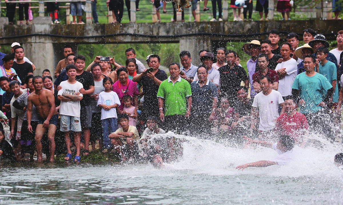 Residents in Dawan Village, South China's Guangxi Zhuang Autonomous Region, celebrate a traditional fish festival on August 27, 2023, to wish for a good seasonal harvest. The festival is popular among the Miao ethnic group in Guangxi and dates back to more than 450 years ago. Photo: VCG