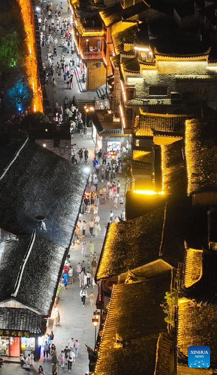 This aerial photo taken on Aug. 25, 2023 shows a night view at Fenghuang ancient town in Xiangxi Tujia and Miao Autonomous Prefecture, central China's Hunan Province. Photo: Xinhua