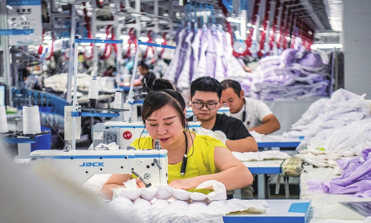 
Workers are busy producing export-oriented clothes ordered by overseas clients at a garment factory in Suncun town in Wuhu city, East China's Anhui Province on August 29, 2023. From January to April this year, China's overall exports of textiles, clothing and accessories totaled $92.88 billion, according to the General Administration of Customs of China. Photo:cnsphoto