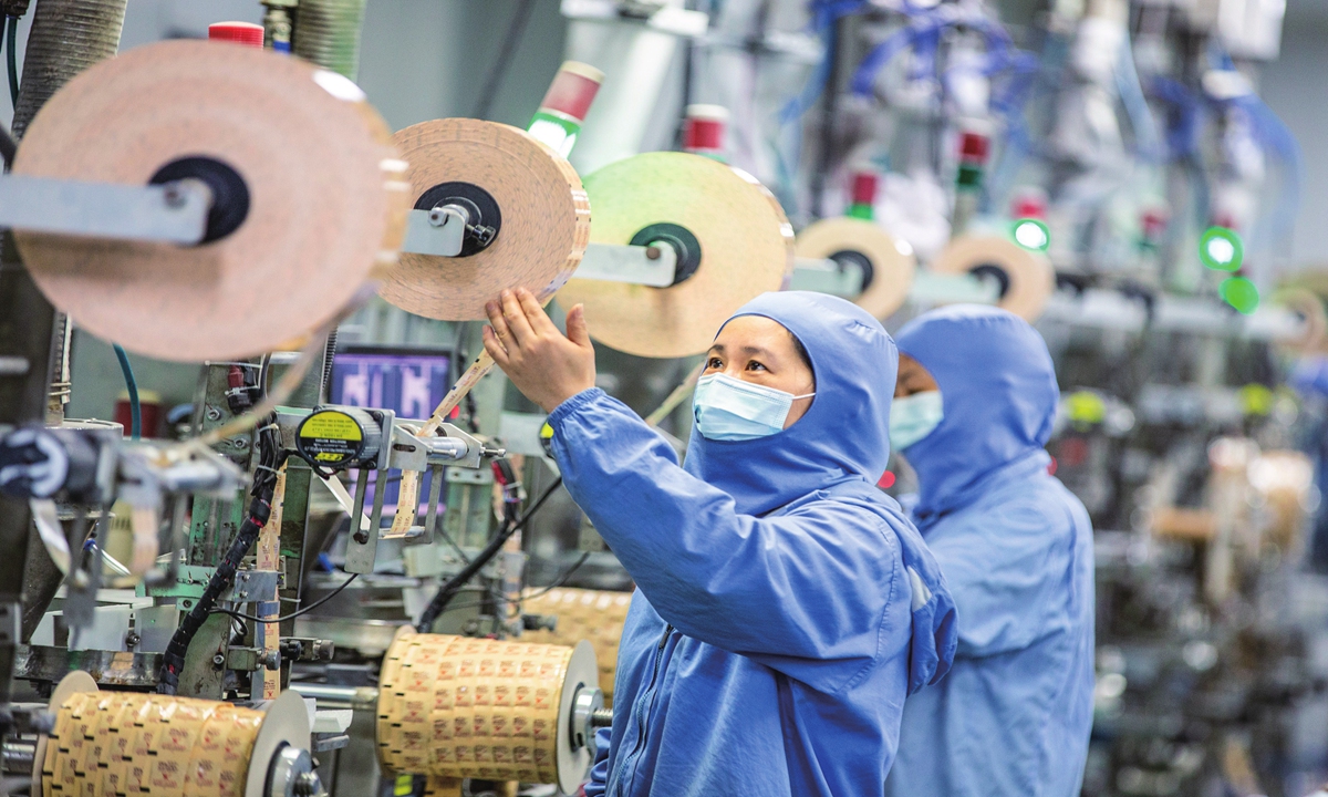 Workers make external food preservatives for domestic and international customers  in Hai'an, East China's Jiangsu Province on August 30, 2023. The local government has been implementing multiple supportive measures to promote the high-quality development of foreign trade enterprises. Photo: cnsphoto