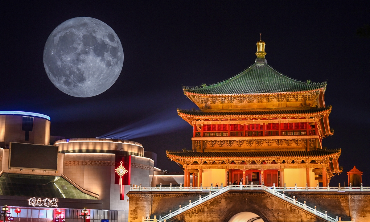 A double-exposure picture shows blue supermoon above the bell tower in Xi'an, Northwest China's Shaanxi Province on August 30, 2023. It is the fifteenth day of the seventh month in the lunar calendar. Photo: VCG