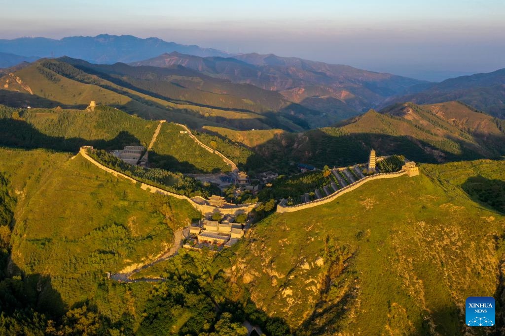 This aerial photo taken on Aug. 30, 2023 shows the Yanmen Pass in Daixian County, north China's Shanxi Province. The Yanmen Pass is a famed part of the Great Wall. The Great Wall, a UNESCO World Heritage Site, consists of many interconnected walls, some dating back 2,000 years.(Photo: Xinhua)