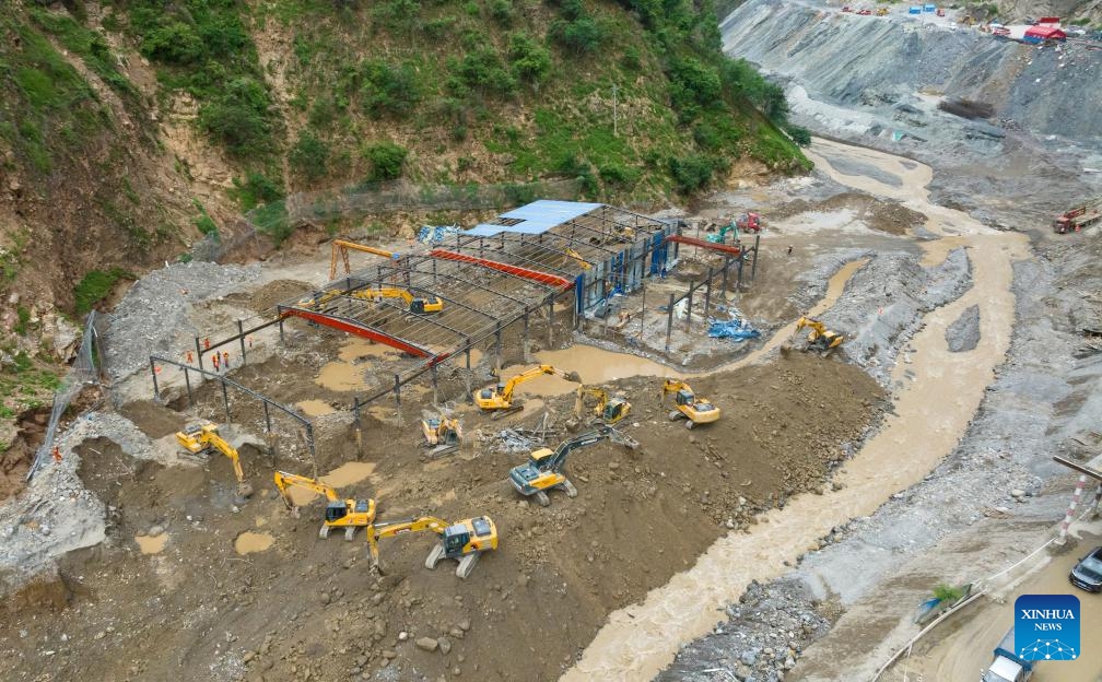 This aerial photo taken on Aug. 30, 2023 shows rescuers working at the make-shift houses of the workers in the steel bar processing site of the Shudao Group that was undertaking the highway construction project in the lower reaches of the Lugaolin River in Jinyang County of Liangshan Yi Autonomous Prefecture, southwest China's Sichuan Province.(Photo: Xinhua)