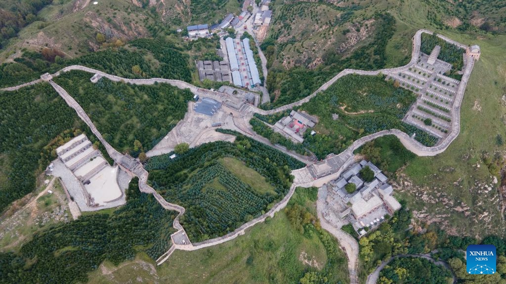 This aerial photo taken on Aug. 29, 2023 shows the Yanmen Pass in Daixian County, north China's Shanxi Province. The Yanmen Pass is a famed part of the Great Wall. The Great Wall, a UNESCO World Heritage Site, consists of many interconnected walls, some dating back 2,000 years.(Photo: Xinhua)