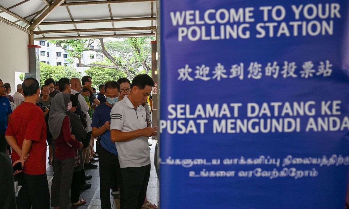 Singaporeans arrive at a polling station to vote in the presidential election on September 1, 2023. It is the country's first presidential election in 12 years and closely watched as a show of support for the ruling People's Action Party. 
Photo: VCG 