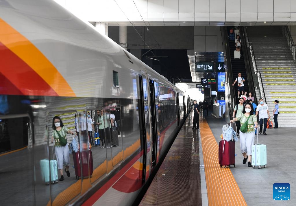 Passengers prepare to board a train at the Chongqing North Railway Station in Chongqing, southwest China, Aug. 31, 2023. The 62-day summer travel rush officially concluded on Thursday.(Photo: Xinhua)