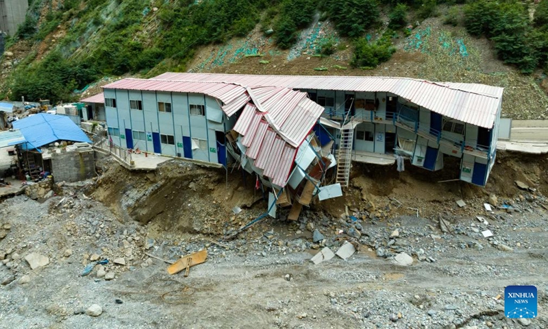 This aerial photo taken on Aug. 30, 2023 shows the make-shift houses of the workers in the steel bar processing site of the Shudao Group that was undertaking the highway construction project in the lower reaches of the Lugaolin River in Jinyang County of Liangshan Yi Autonomous Prefecture, southwest China's Sichuan Province.(Photo: Xinhua)