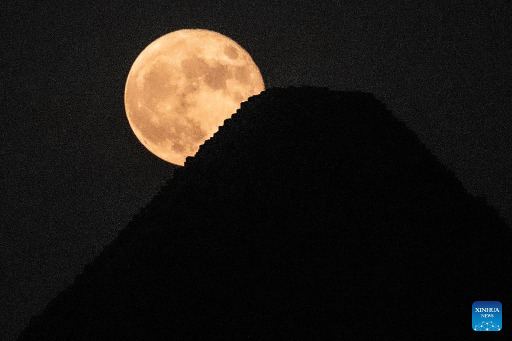 A supermoon is seen in the sky over the Khufu Pyramid in Giza, Egypt, on Aug. 31, 2023.(Photo: Xinhua)