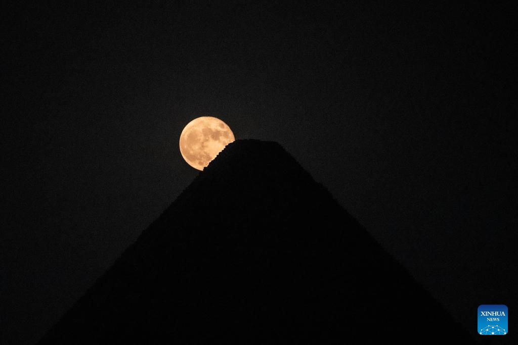 A supermoon is seen in the sky over the Khufu Pyramid in Giza, Egypt, on Aug. 31, 2023.(Photo: Xinhua)