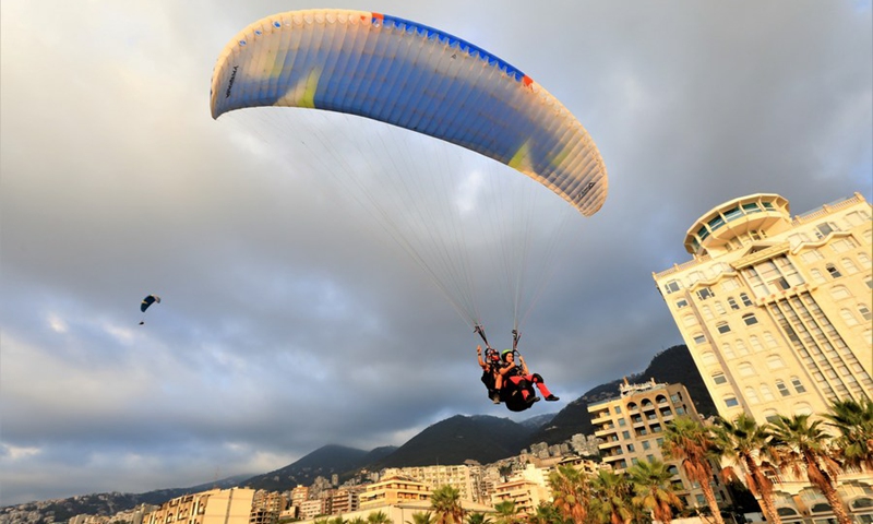 People paraglide over the city of Jounieh, Lebanon, on Aug. 26, 2023. Photo: Xinhua