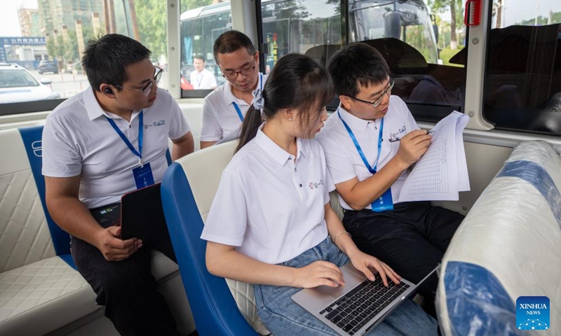 Referees check the information of participating vehicles during the Smart China Expo Smart Automobile Scenario Challenge in Yongchuan District of southwest China's Chongqing, Sept. 2, 2023. The challenge was held in Yongchuan District of Chongqing from Sept. 1 to 3. More than 180 industry representatives and 19 teams from the field of intelligent vehicles participated in the competition. Photo: Xinhua