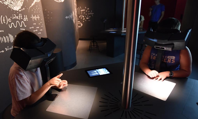 Visitors experience VR technology at House of Music in Vienna, Austria, on Sept. 2, 2023. House of Music is an interactive sound museum located in Vienna, to provide a playful approach to understand music. Photo: Xinhua