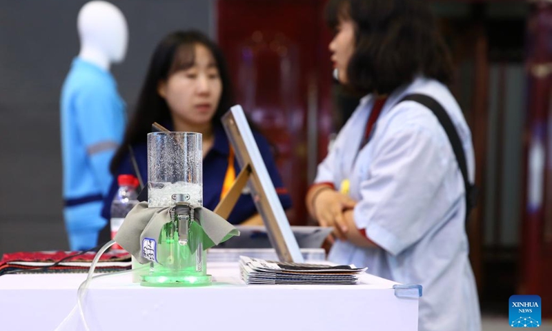 A visitor learns about topological softgel, a new material which can be applied in textiles, at the environmental services exhibition of the 2023 China International Fair for Trade in Services (CIFTIS) in Beijing, capital of China, Sept. 2, 2023. Themed Opening-up leads development, cooperation delivers the future, the 2023 CIFTIS is being held in Beijing from Sept. 2 to 6 and features over 200 varied events, including forums, negotiations, and summits. (Photo: Xinhua)