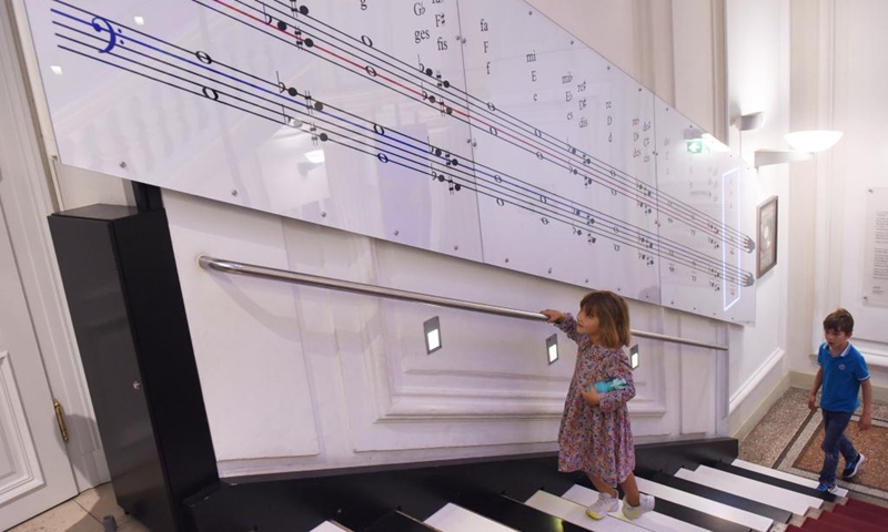 Visitors climb the Stairplay at House of Music in Vienna, Austria, on Sept. 2, 2023. House of Music is an interactive sound museum located in Vienna, to provide a playful approach to understand music. Photo: Xinhua