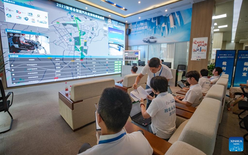 Referees watch participating vehicles via live video during the Smart China Expo Smart Automobile Scenario Challenge in Yongchuan District of southwest China's Chongqing, Sept. 2, 2023. The challenge was held in Yongchuan District of Chongqing from Sept. 1 to 3. More than 180 industry representatives and 19 teams from the field of intelligent vehicles participated in the competition. Photo: Xinhua