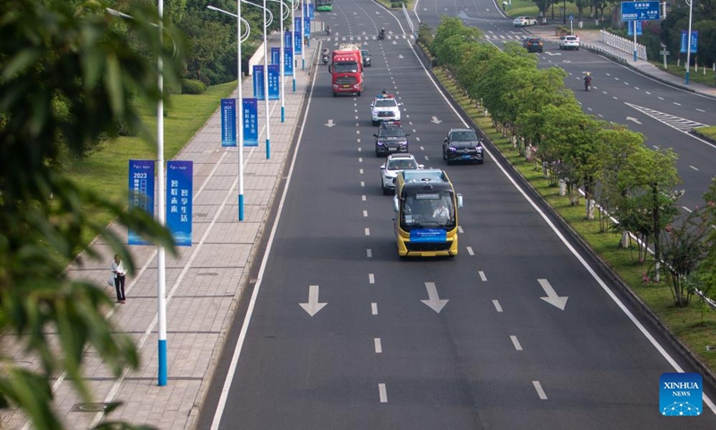 A self-driving bus (front) takes part in the Smart China Expo Smart Automobile Scenario Challenge in Yongchuan District of southwest China's Chongqing, Sept. 2, 2023. The challenge was held in Yongchuan District of Chongqing from Sept. 1 to 3. More than 180 industry representatives and 19 teams from the field of intelligent vehicles participated in the competition. Photo: Xinhua