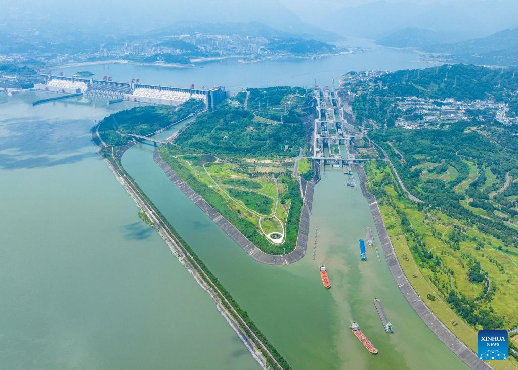 This aerial photo taken on Aug. 23, 2023 shows ships passing through the five-tier ship locks of the Three Gorges Dam in Yichang, central China's Hubei Province. The monthly cargo throughput via the five-tier ship locks at the Three Gorges Dam, the world's largest hydropower project in the upper stream of the Yangtze, reached a record high of over 15.71 million tonnes in August, according to the China Three Gorges Corporation.(Photo: Xinhua)