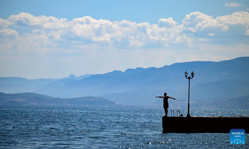 A man jumps into Ohrid Lake in Struga, North Macedonia, on Sept. 3, 2023.(Photo: Xinhua)