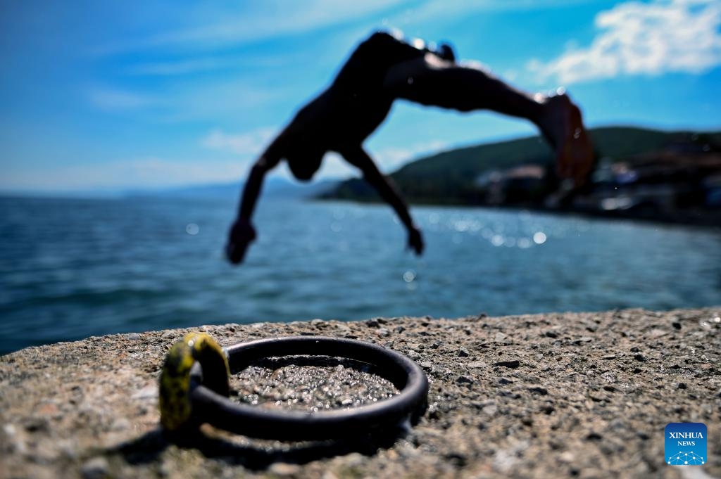 A man jumps into Ohrid Lake in Struga, North Macedonia, on Sept. 3, 2023.(Photo: Xinhua)