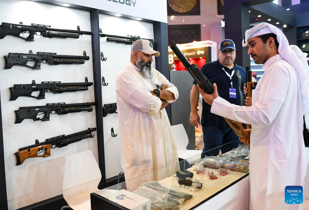 People look at hunting rifles in the guns section of the seventh edition of Katara International Hunting and Falcons Exhibition 2023 at Katara Cultural Village in Doha, Qatar, Sept. 5, 2023. The event is held here from Sept. 5 to 9 with the participation of more than 190 international exhibitors.(Photo: Xinhua)