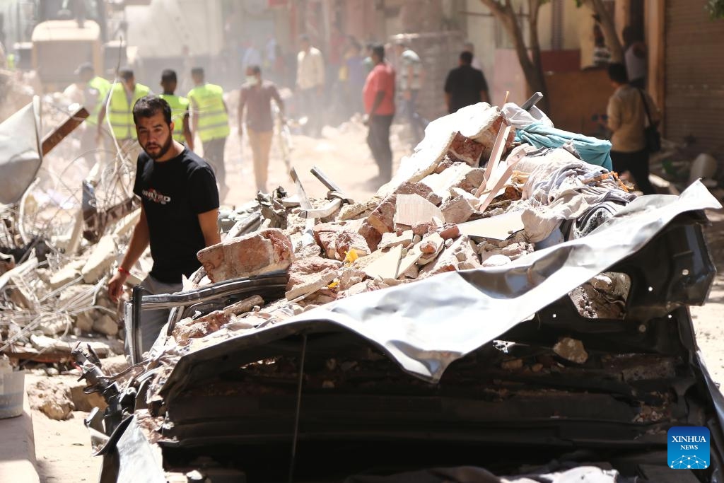 A damaged car is seen at the site of a collapsed building in Cairo, Egypt, Sept. 6, 2023. At least four people were killed and five others wounded on Wednesday in a building collapse in Egypt's capital Cairo, the state-run Ahram newspaper reported.(Photo: Xinhua)