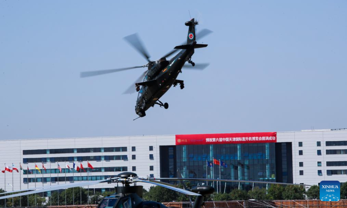 A helicopter of China's Fenglei aerobatic team is seen during a performance at the opening ceremony of the 6th China Helicopter Exposition in north China's Tianjin Municipality Sep 14, 2023. Photo:Xinhua