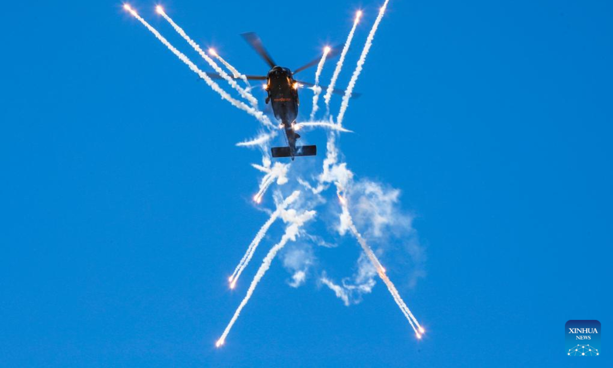 A helicopter of China's Fenglei aerobatic team is seen during a performance at the opening ceremony of the 6th China Helicopter Exposition in north China's Tianjin Municipality Sep 14, 2023. Photo:Xinhua