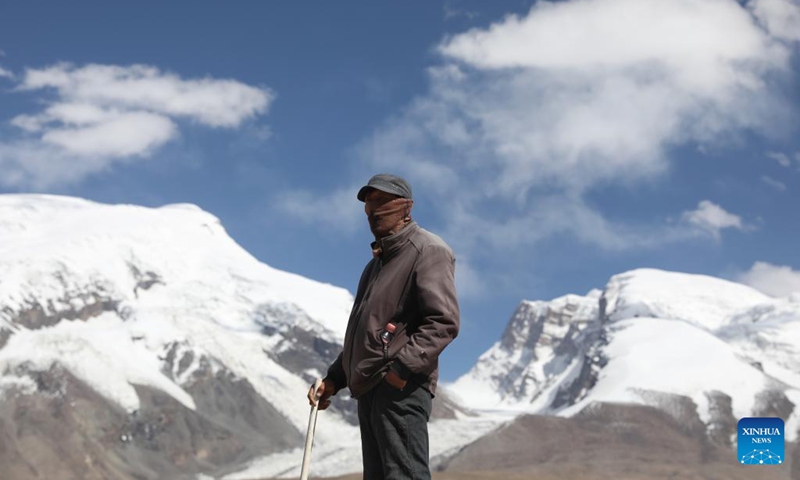 Sheepherder Kurbanali Matsayin is seen at the foot of Mount Muztagata on the Pamir Plateau, northwest China's Xinjiang Uygur Autonomous Region, Sept. 6, 2023. Photo: Xinhua