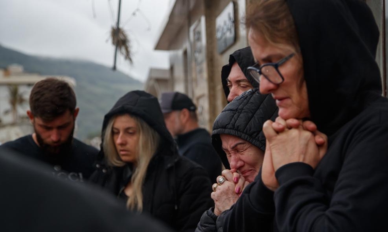 People mourn during the burial of a victim at the municipal cemetery at the city of Mucum, Rio Grande do Sul, Brazil, on Sept. 9, 2023. Photo: Xinhua