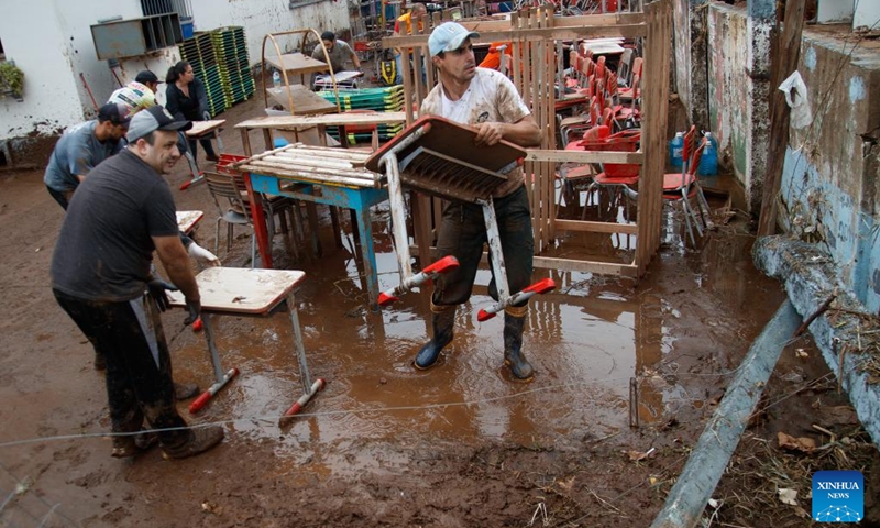 People clean up a school at the city of Mucum, Rio Grande do Sul, Brazil, on Sept. 9, 2023. Photo: Xinhua