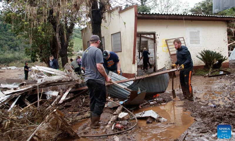 People remove house debris at the city of Mucum, Rio Grande do Sul, Brazil, on Sept. 9, 2023. Photo: Xinhua