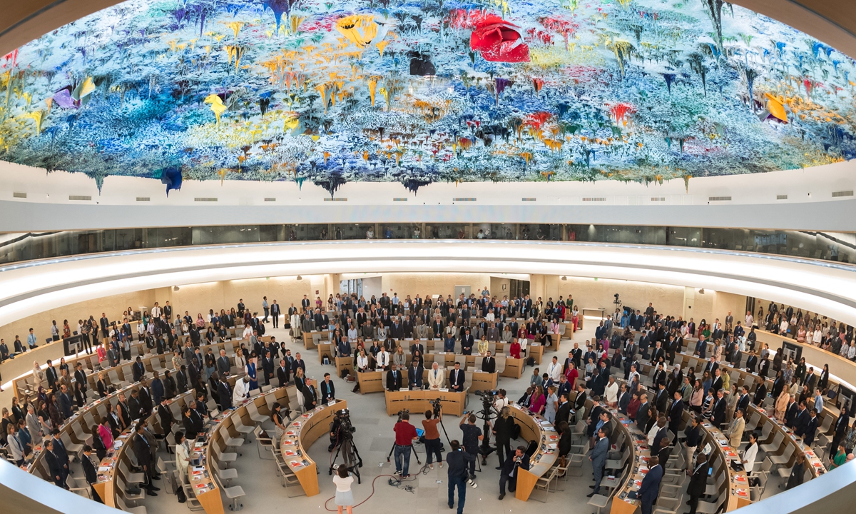 Delegates stand for a minute of silence following the deadly 6.8-magnitude September 8 earthquake, in central Morocco, at the opening of the 54th UN Human Rights Council in Geneva, on September 11, 2023. The devastating quake has killed nearly 2,500 people and injured some 2,500 others, many seriously, according to official update on September 11. Photo: AFP